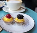 Mini fruit italian cupcakes with fresh berries on board Royalty Free Stock Photo