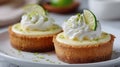 Two mini lemon tarts topped with whipped cream and lemon zest Royalty Free Stock Photo