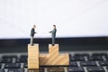 Two miniature businessmen shaking hands Royalty Free Stock Photo