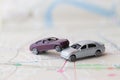 Two Miniature cars accident crash on road, insurance case and broken toys auto car on on Bangkok city map background. Vehicle Royalty Free Stock Photo