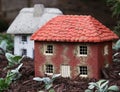 Two miniature houses is a garden Royalty Free Stock Photo