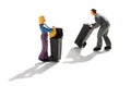 Two miniature people using rubbish bins Royalty Free Stock Photo