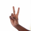 Two minutes please.... Studio shot of an unrecognisable man making a peace sign against a white background. Royalty Free Stock Photo