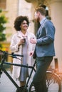 Two mixed race business people talking outside company Royalty Free Stock Photo