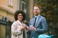 Two mixed race business people talking outside company Royalty Free Stock Photo