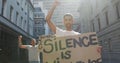 Two mixed race men on a protest march holding placards raising hands and shouting