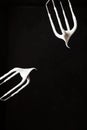 Two mixer whisks with cream on black background Royalty Free Stock Photo