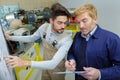 two modern aircraft engineers reading information on clipboard