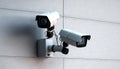 Two modern cctv security cameras concrete wall camera surveillance control equipment electronic guard protection safety spy watch Royalty Free Stock Photo