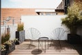 two modern chairs on a rooftop balcony Royalty Free Stock Photo