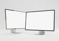 Two modern computer monitors with blank screens positioned side by side on a clean white surface Royalty Free Stock Photo