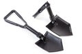 Two modern folding steel entrenching tools on white background