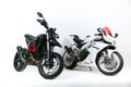 Two modern motorcycles Aprilia and Ducati on white background.