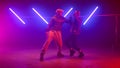 Couple performers making hiphop show in club. Two modern dancing street style. Royalty Free Stock Photo