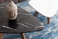 Two modern stool made of black and white artificial stone stands on a carpet with fine nap, a top view. Royalty Free Stock Photo