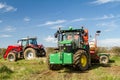 Two Modern tractors parked up after drilling seed in field