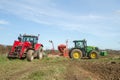 Two Modern tractors parked up after drilling seed in field