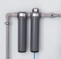 Two modern water filters for cleaning large amounts of water, water filters are located on the wall, close-up, water filter Royalty Free Stock Photo