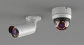 Two Modern White Security Surveillance Cameras Mounted on a Gray Surface Royalty Free Stock Photo