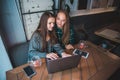 Two modern women having meeting in cafe. working on laptop ant tablet Royalty Free Stock Photo