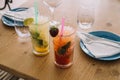 Two mojito cocktails made with aged rum, mint, and different fruits. Royalty Free Stock Photo