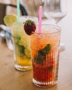 Two mojito cocktails made with aged rum, mint, and different fruits. Royalty Free Stock Photo