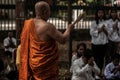 Two Monks broadcasting holy water