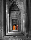 Two monks stand in a gate at Angkor Wat, Cambodia. Royalty Free Stock Photo