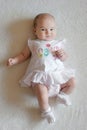 Two month old baby in a white dress Royalty Free Stock Photo