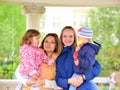 Two mothers with children on the walk in gazebo