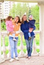 Two mothers with children on the walk in gazebo