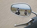 Two motorcyclists in the rearview mirror