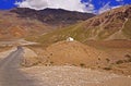 Two Motorcyclists on the Winding Mountain Road in the High-Altitude Mountain Desert in the Himalayas