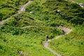 Two mountain bikers descending downhill from Joch Pass in Switzerland. Royalty Free Stock Photo