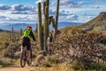 Two Mountain Bikers On Desert Trail In Arizona