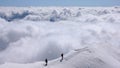 Two mountain climbers on an exposed ridge in the Swiss Alps Royalty Free Stock Photo