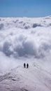 Two mountain climbers on an exposed ridge in the Swiss Alps Royalty Free Stock Photo