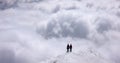 Two mountain climbers on an exposed ridge in the Swiss Alps Royalty Free Stock Photo