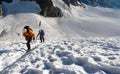 Two mountain climbers on a high alpine glacier