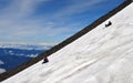 Mountain Climbers Glissade down a Mountainside