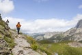 Two mountaineers hiking in the high of a mountain