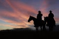 Two mounted cowboy silhouettes Royalty Free Stock Photo