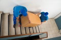 Two Movers With Box On Staircase Royalty Free Stock Photo