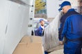 Two Movers Unloading Furniture From Truck Royalty Free Stock Photo