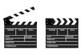 Two movie clappers open and close isolated on white background. Royalty Free Stock Photo