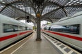 Two moving ICE trains, Inter City Express, at the central train station in Cologne, Germany.