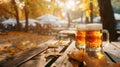 Two mugs of beer resting on a wooden table against a scenic autumn backdrop, Ai Generated Royalty Free Stock Photo