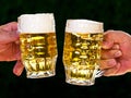 Two mugs of beer with us beer foam Royalty Free Stock Photo