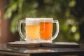 Two mugs of chopp on the table Royalty Free Stock Photo