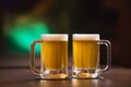 Two mugs of chopp on the table. Royalty Free Stock Photo